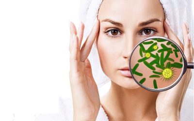 Woman washing-up her face. Protection from germs. Isolated on white.